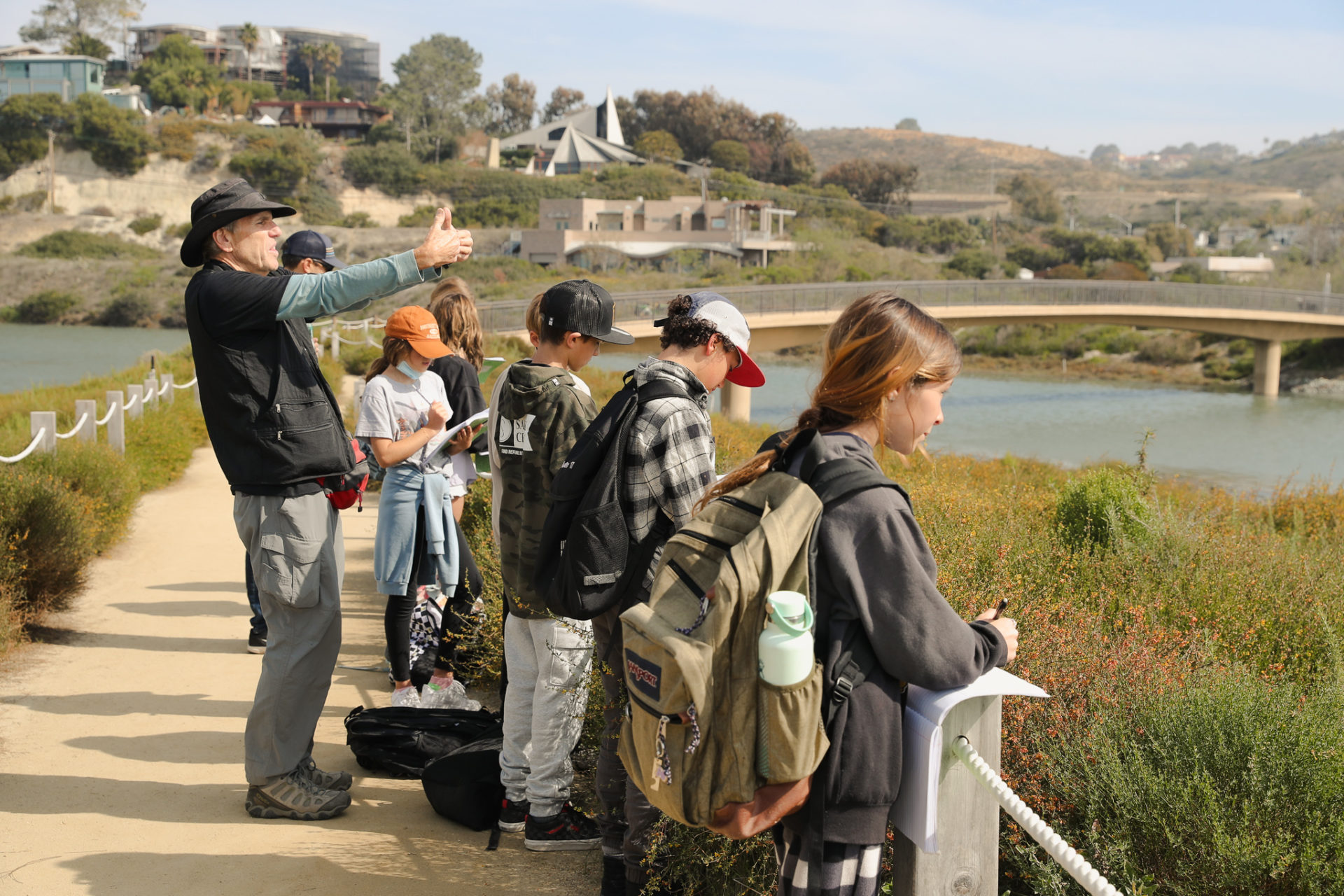 A group of students overlooking San Elijo Lagoon Channel